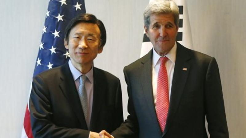 US Secretary of State John Kerry and South Korea's Foreign Minister Yun Byung-se shake hands during a meeting in Munich Germany