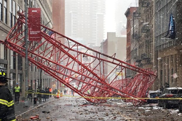 The crane crushed cars and trapped several people inside their vehicles
AP:Associated Press