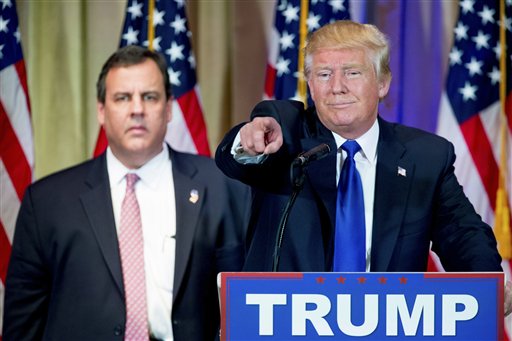 Republican presidential candidate Donald Trump accompanied by New Jersey Gov. Chris Christie left takes questions from members of the media during a news conference on Super Tuesday primary election night in the White and Gold Ballroom at The Mar-A-Lag