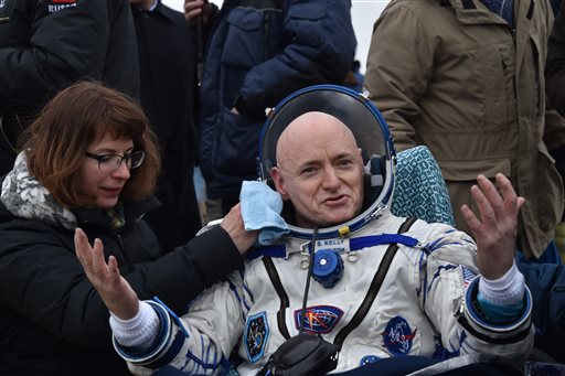 International Space Station crew member Scott Kelly of the U.S. reacts after landing near the town of Dzhezkazgan Kazakhstan on Wednesday