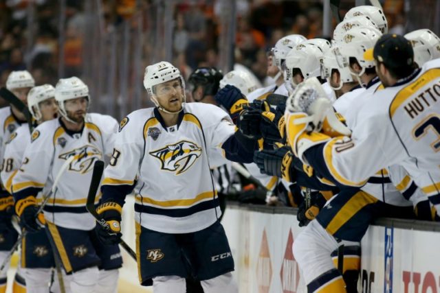 Colin Wilson of the Nashville Predators skates past team's bench after scoring a goal during their NFL first round playoff game against the Anaheim Ducks at the Honda Center in Anaheim California