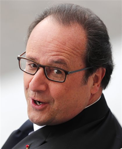 French President Francois Hollande looks on during the Bastille Day Parade in Paris Thursday