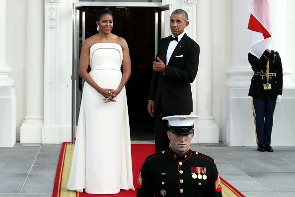 WASHINGTON DC- AUGUST 02 U.S. first lady Michelle Obama and U.S. President Barack Obama wait for the arrival of Prime Minister Lee Hsien Loong of Singapore and his wife Ho Ching on the North Portico of the White House