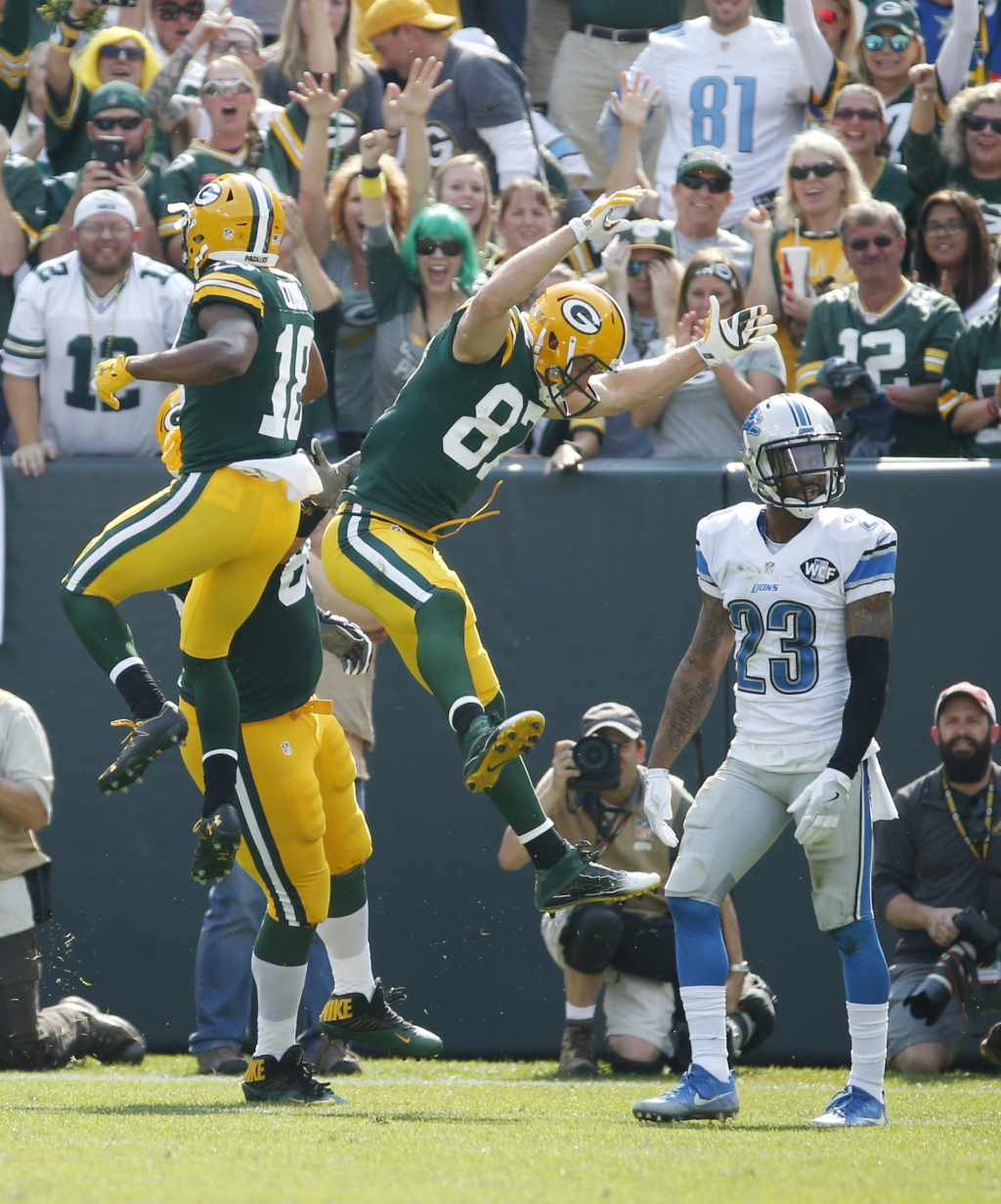 Green Bay Packers&#039 Jordy Nelson celebrates his touchdown catch with teammate Davante Adams as Detroit Lions&#039 Darius Slay walks off the field during the first half of an NFL football game Sunday Sept. 25 2016 in Green Bay Wis