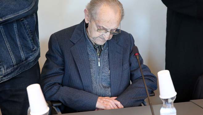 Hubert Zafke sits in a courtroom ahead of his trial in Neubrandenburg eastern Germany Monday Sept. 12 2016. The former SS medic who served at the Auschwitz death camp has gone on trial in the northern German city of Neubrandenburg though questions