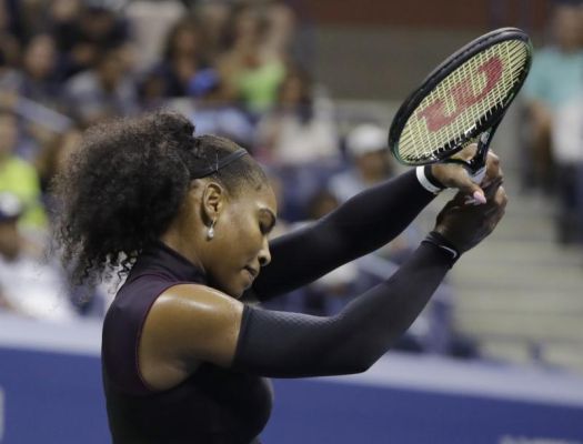 Serena Williams reacts after a point to Karolina