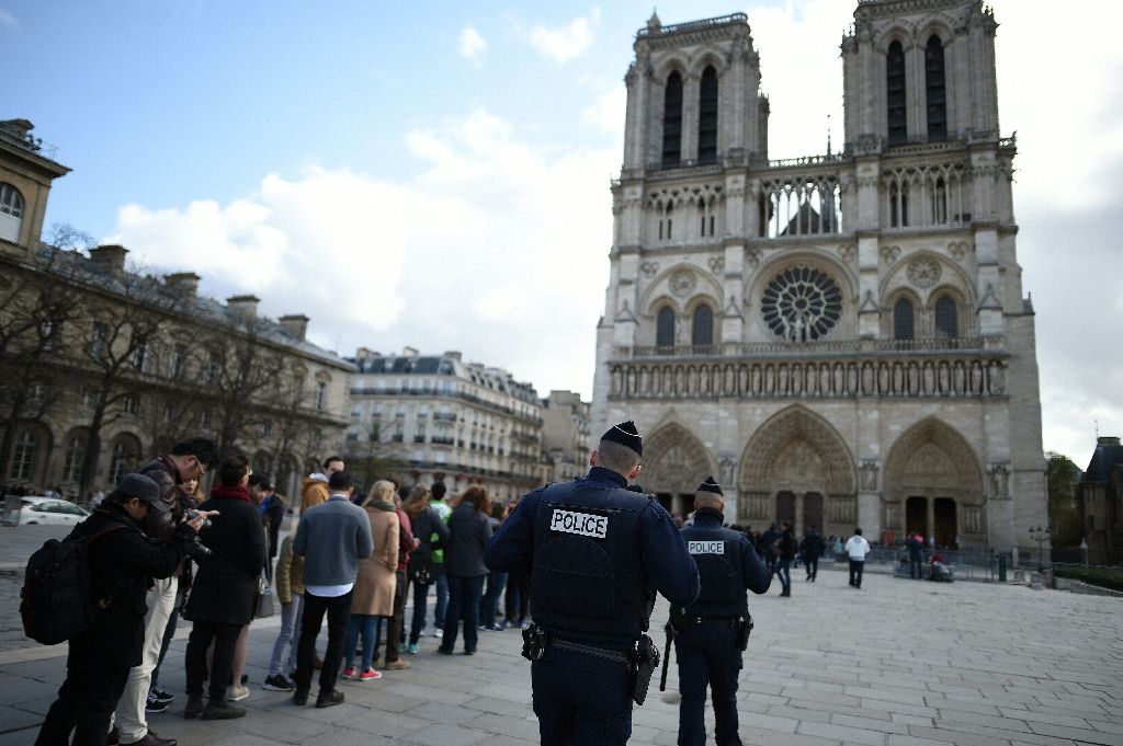 French police patrol outside Notre Dame cathedral