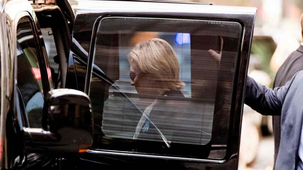 Democratic presidential candidate Hillary Clinton gets into a van as she leaves an apartment building Sunday Sept. 11 2016 in New York