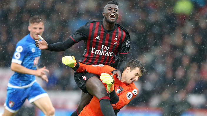 Jordan Holmes brings down AC Milan's M'Baye Niang to concede a penalty