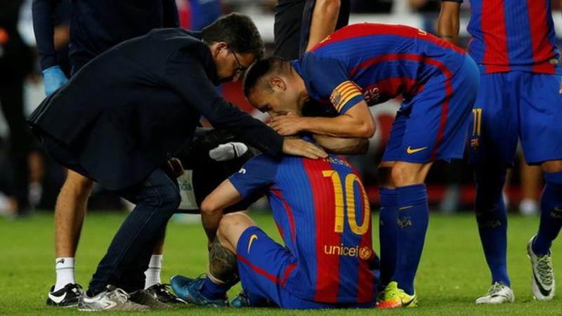 Lionel Messi out for three weeks after suffering groin injury during game