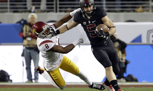 Stanford running back Christian Mc Caffrey stiff-arms Southern California's Iman Marshall on a kickoff return during the Pac-12 Conference championship NCAA college football game in Santa Clara Calif. Stan