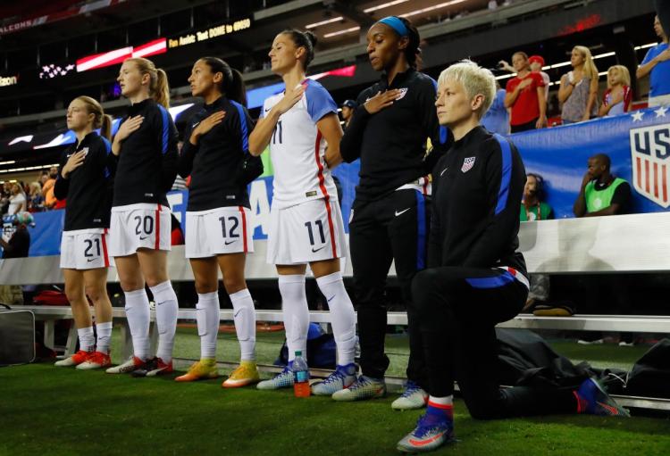 Following a warning from U.S. Soccer that they expect players to stand during the playing of the national anthem Megan Rapinoe takes a knee on Sunday night in Atlanta