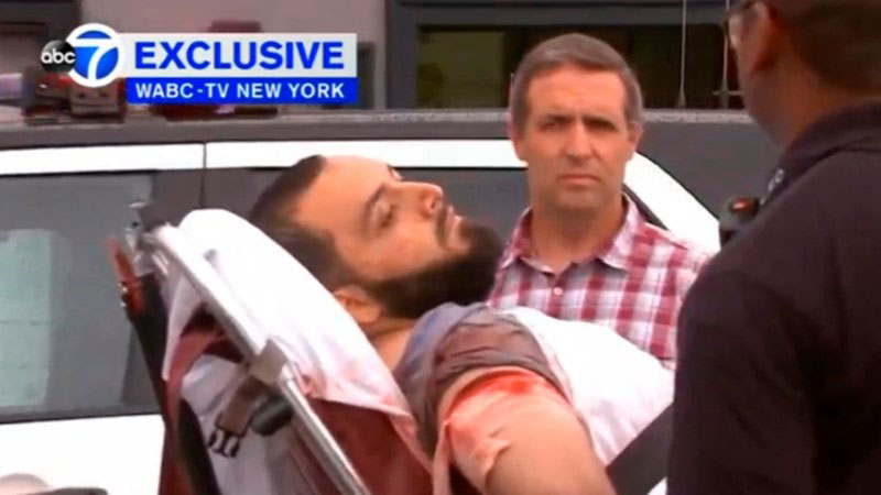 A still image captured from a video from WABC television shows a conscious man believed to be New York bombing suspect Ahmad Khan Rahami being loaded into an ambulance after a shoot-out with police in Linden New Jersey US