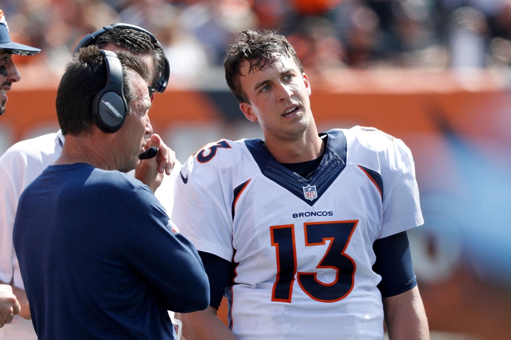 Trevor Siemian of the Denver Broncos talks with Head Coach Gary Kubiak of the Denver Broncos on the sidelines during the second quarter of the game against the Cincinnati Bengals at Paul Brown Stadium on Sept. 25 2016