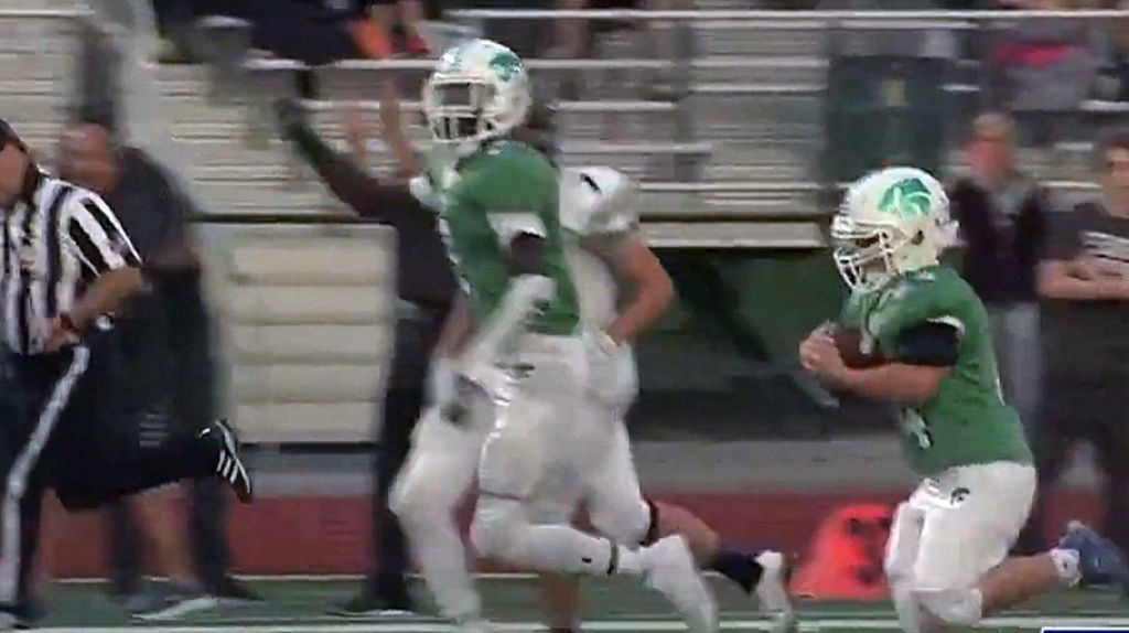 High School Football Teams Collaborate on Memorable Touchdown for Water Boy