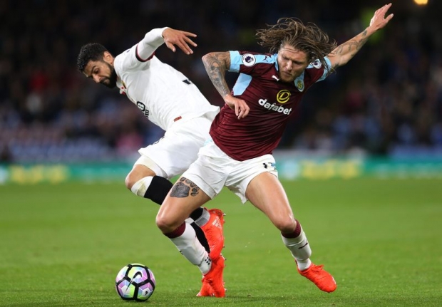 Watford's Miguel Britos in action with Burnley's Jeff Hendrick in an EPL encounter at Turf Moor Burnley