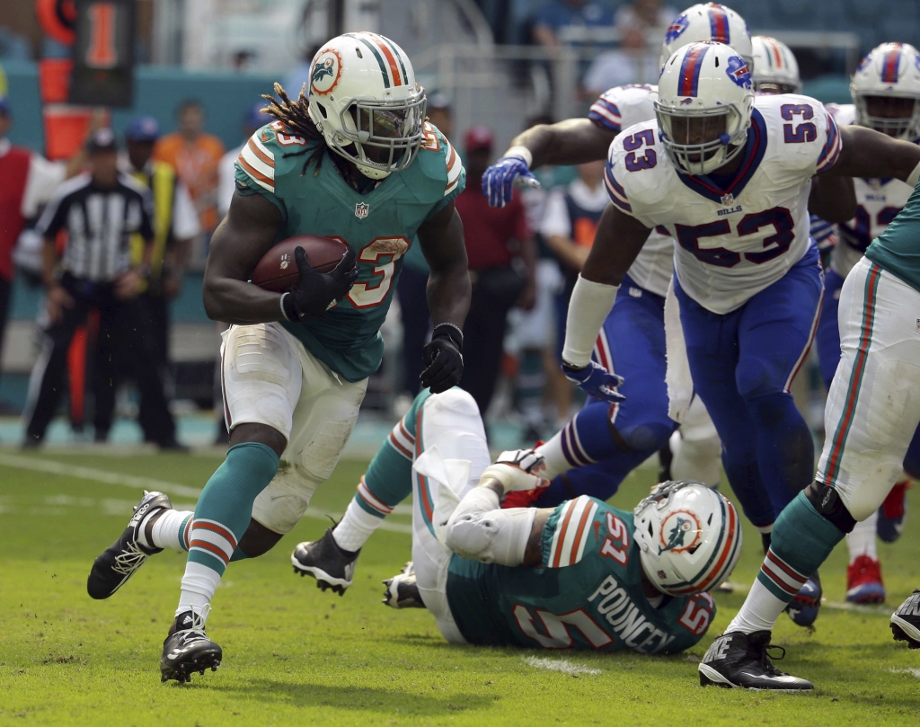 Miami Dolphins running back Jay Ajayi runs the ball during the second half of an NFL football game against the Buffalo Bills Sunday Oct. 23 2016 in Miami Gardens Fla