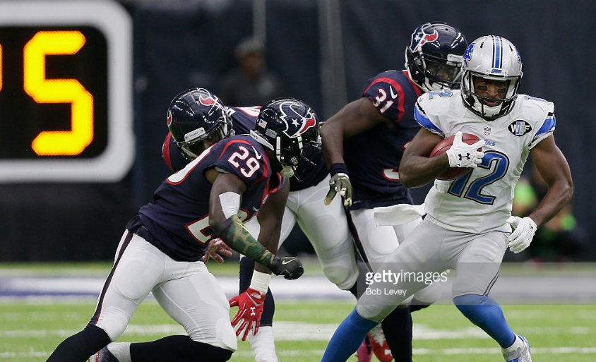 Andre Roberts of the Lions gains ground against the Texans Sunday in Houston. Getty Images