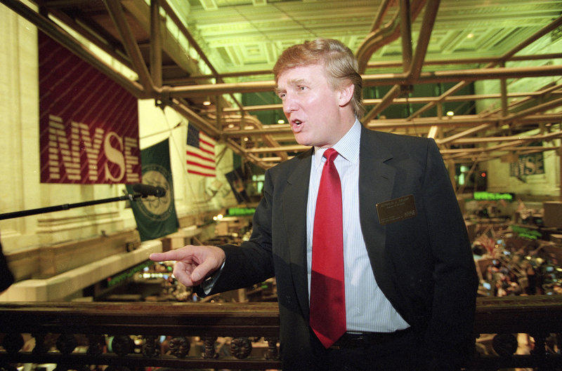 Real estate magnate Donald Trump stands above the New York Stock Exchange after taking his flagship Trump Plaza Casino public in New York City. Trump's business losses in 1995 were so large that they could have allowed him to avoid paying federal inc