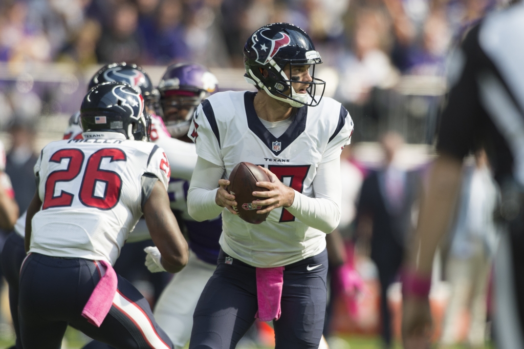 MINNEAPOLIS MN- OCTOBER 9 Quarterback Brock Osweiler #17 of the Houston Texans drops back to pass during the first quarter of the game