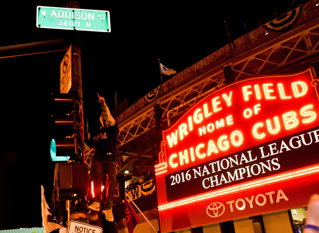 Chicago Cubs fans celebrate outside Wrigley Field after the Cubs defeated the Los Angeles Dodgers 5-0 in Game 6 of baseball's National League Championship Se