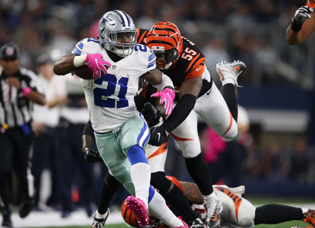 Oct 9 2016 Arlington TX USA Dallas Cowboys running back Ezekiel Elliott runs with the ball against Cincinnati Bengals cornerback Dre Kirkpatrick linebacker Vontaze Burfict and Rey Maualuga in the third quarter at AT&T Stadium. Cow