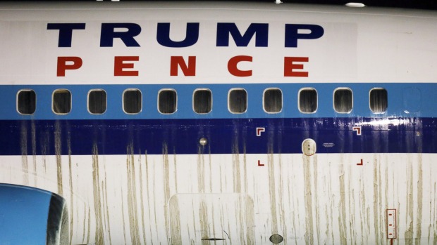 Mud is seen on the side of a campaign plane that had been carrying US Republican vice presidential nominee Mike Pence