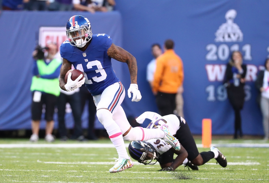 EAST RUTHERFORD NJ- OCTOBER 16 Odell Beckham #13 of the New York Giants scores the go ahead touchdown against Tavon Young #36 of the Baltimore Ravens in the fourth quarter with the Giants winning 27-23 during their game at Met Life Stadium on October