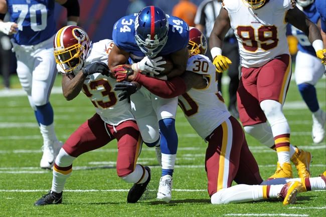 2016 Washington Redskins De Angelo Hall and David Bruton tackle New York Giants running back Shane Vereen during the first half of an NFL football game in East Rutherford N.J. Redskins coach Jay Gruden says