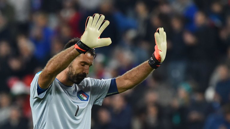 Italy's goalkeeper Gianluigi Buffon salutes fans at the end of the World Cup Qualifier against Spain