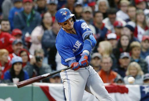 Toronto Blue Jays Troy Tulowitzki hits an RBI-single during the eighth inning of a baseball game against the Boston Red Sox in Boston Sunday Oct. 2 2016