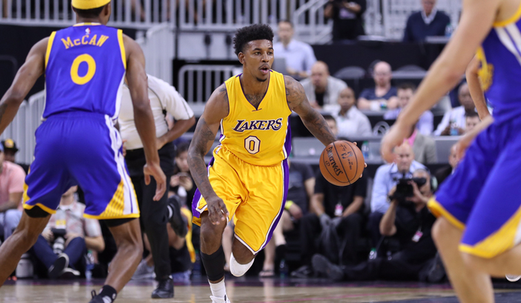 Lakers forward Nick Young drives against the Warriors defense