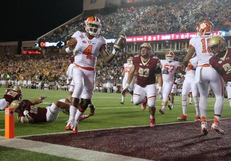 Chestnut Hill MA 10/7/16 Clemson Tigers quarterback Deshaun Watson scoring a rushing touchdown gliding into the end zone leaving Boston College Eagles in his wake during first half action at Alumni Stadium on Friday