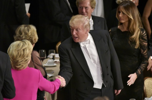 Donald Trump shakes hands with Hillary Clinton at the Waldorf Astoria Hotel in New York