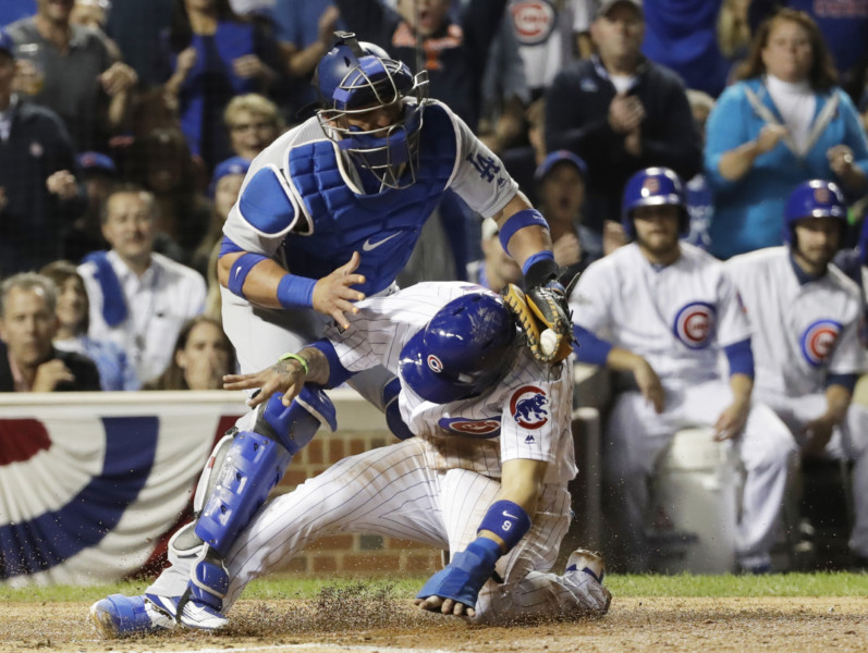 Chicago Cubs&#039 Javier Baez steals home against Los Angeles Dodgers catcher Carlos Ruiz during the second inning of Game 1 of the National League baseball championship series Saturday Oct. 15 2016 in Chicago