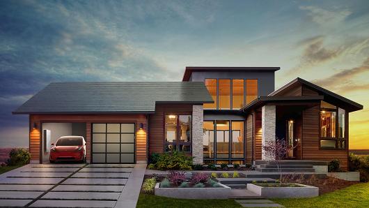 An image of Tesla's solar roof new Powerwall 2 and Tesla charger