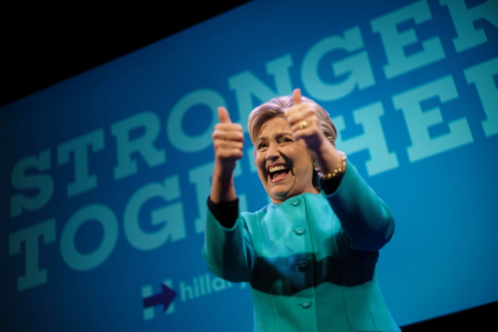 TOPSHOT- Democratic presidential nominee Hillary Clinton cheers after speaking at a fundraiser at the Paramount Theater