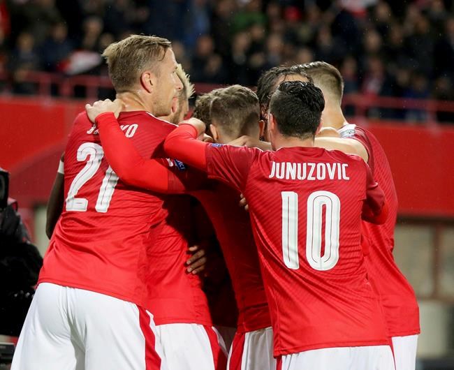 Austria‚Äôs players react after scoring against Wales during their World Cup Group D qualifying soccer match at the Ernst Happel Stadium in Vienna Austria Thursday Oct. 6 2016