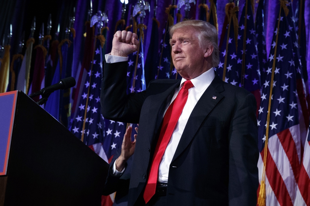 President-elect Donald Trump pumps his fist during an election night rally Wednesday in New York