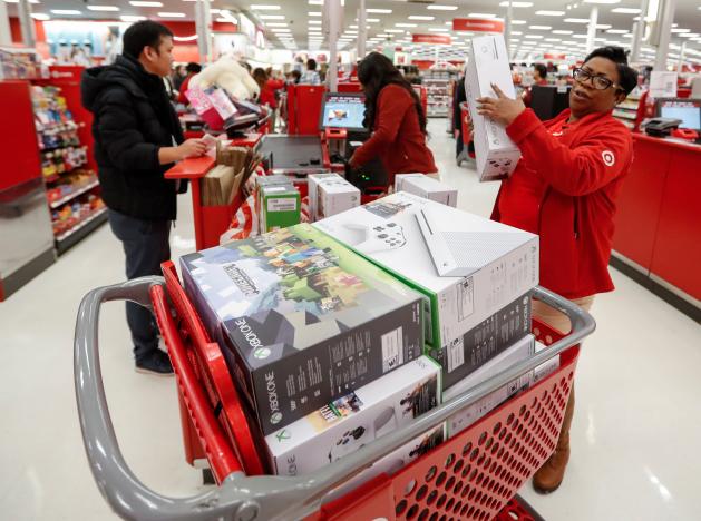 Store employee helps a customer with his purchase during the Black Friday sales event on Thanksgiving Day at Target in Chicago Illinois U.S