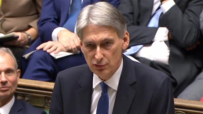 British Chancellor of the Exchequer Philip Hammond speaking to Members of Parliament