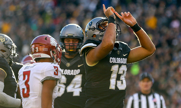 BOULDER CO- NOVEMBER 19 Quarterback Sefo Liufau #13 of the Colorado Buffaloes celebrates his second quarter touchdown against the Washington State Cougars at Folsom Field