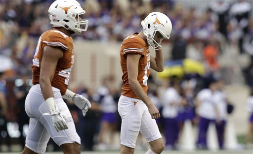 Texas place kicker Trent Domingue walks off the field after missing a field goal against TCU during the first half of an NCAA college football game Friday Nov. 25 2016 in Austin Texas