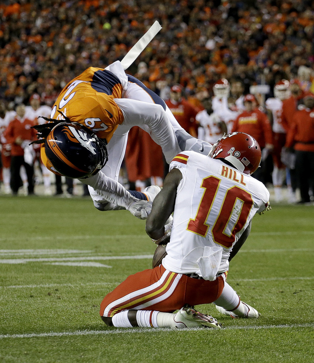 Kansas City Chiefs wide receiver Tyreek Hill makes a touchdown catch as Denver Broncos cornerback Bradley Roby defends during the second half of