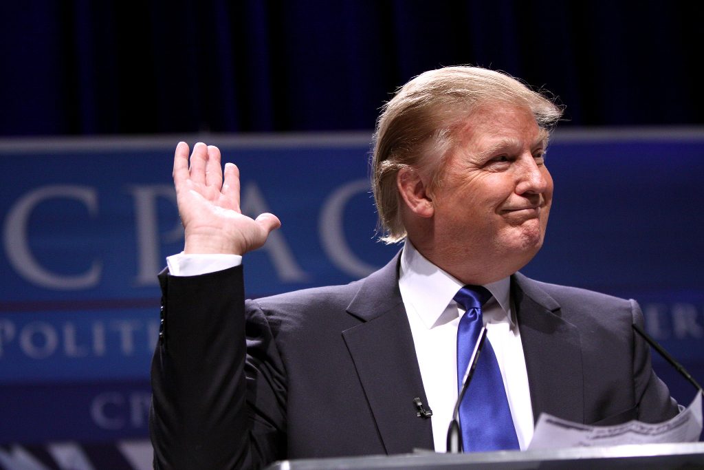 Donald Trump at an event with a smug expression