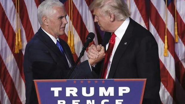 Donald Trump greets his running mate Mike Pence during his election night rally in Manhattan. REUTERS  Mike Segar