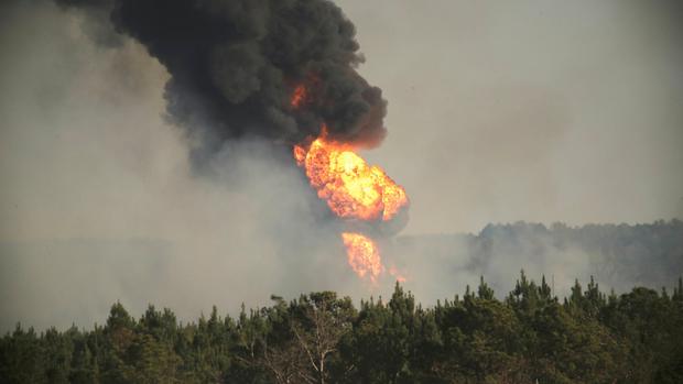 Flames shoot into the sky from a gas line explosion in western Shelby County Alabama U.S