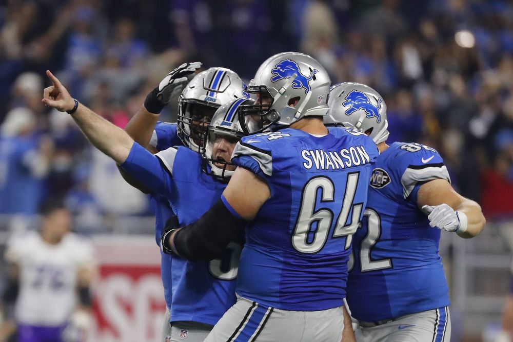 Detroit Lions kicker Matt Prater is congratulated by teammates after kicking a 40-yard game winning field goal during the second half of an NFL football game against the Minnesota Vikings Thursday Nov. 24 2016 in Detroit