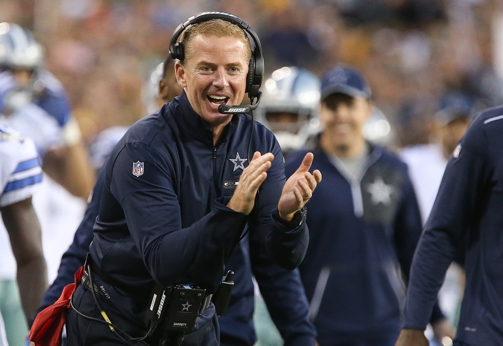 GREEN BAY WI- OCTOBER 16 Head coach Jason Garrett of the Dallas Cowboys cheers on his team against the Green Bay Packers during the fourth quarter at Lambeau Field