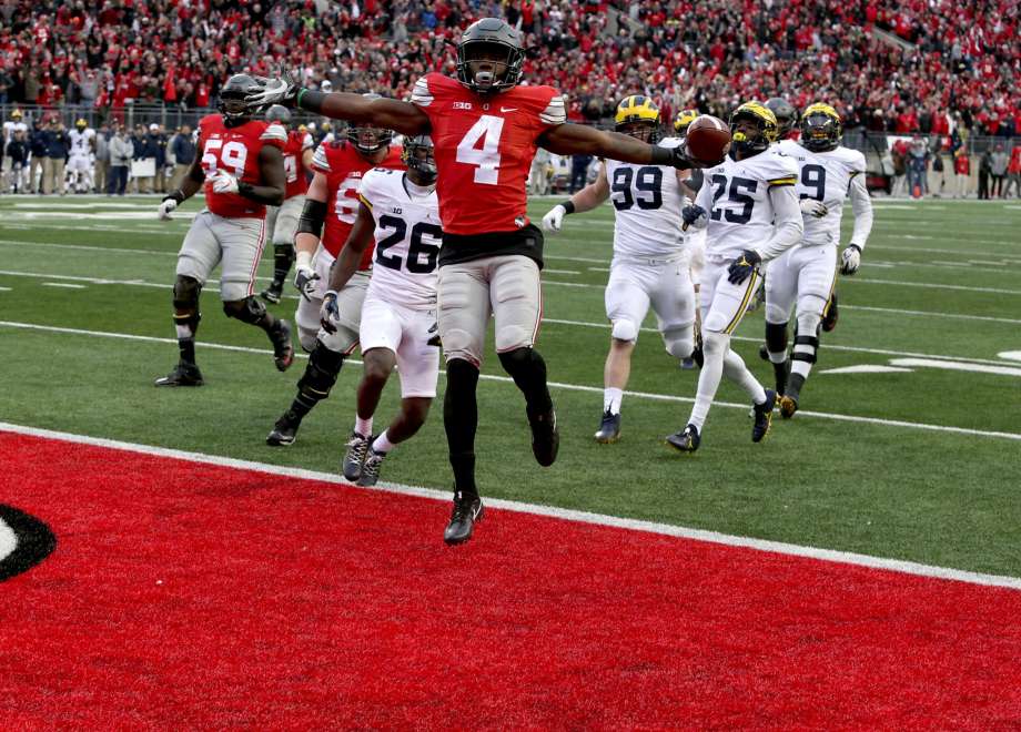 Ohio State’s Curtis Samuel jumps for joy and into the end zone in the second overtime to clinch a 30-27 win against Michigan